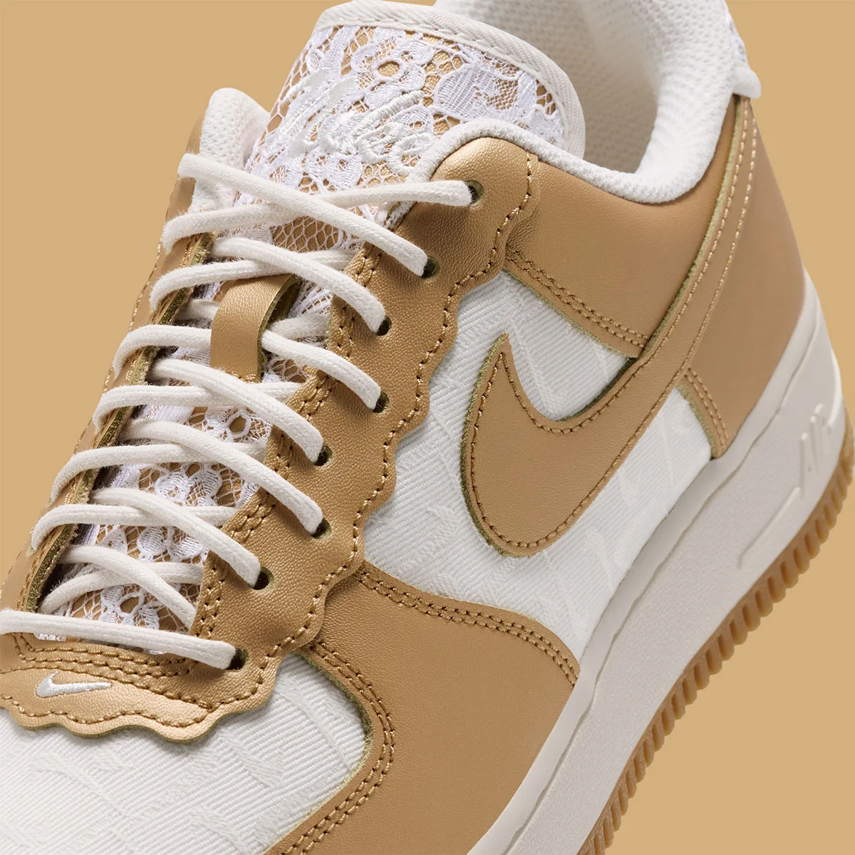 Detail of laced forefoot, scalloped gold eyestay, lace tongue, gold Swoosh, cream laces, Lace