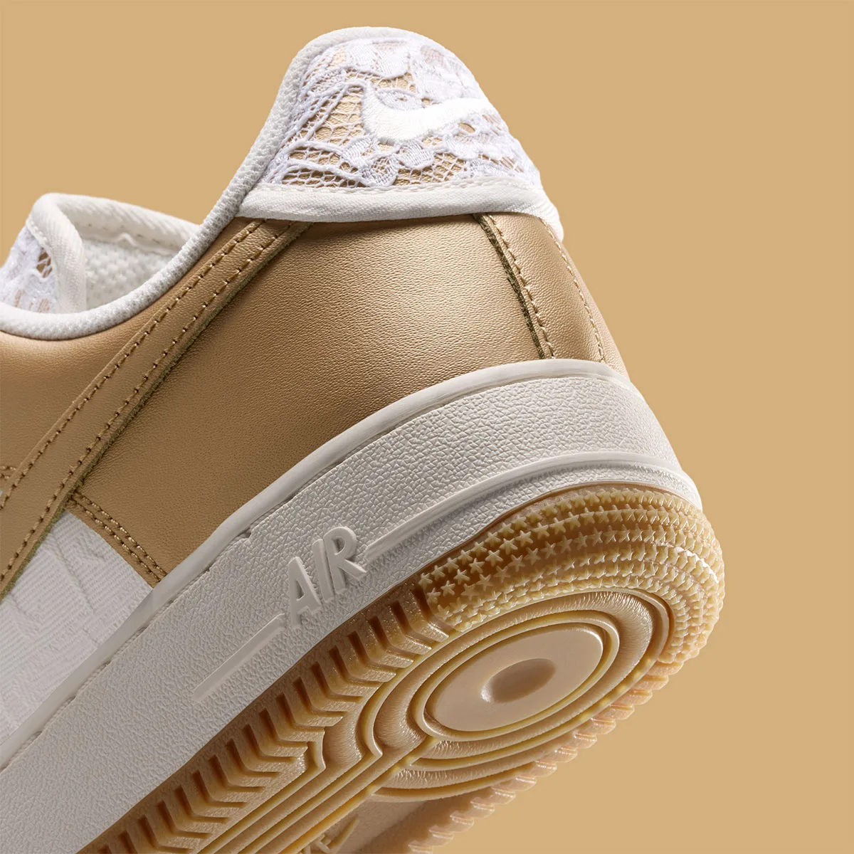 Detail of heel, white lace tab, gold leather, raised AIR text on midsole, gum sole, Lace