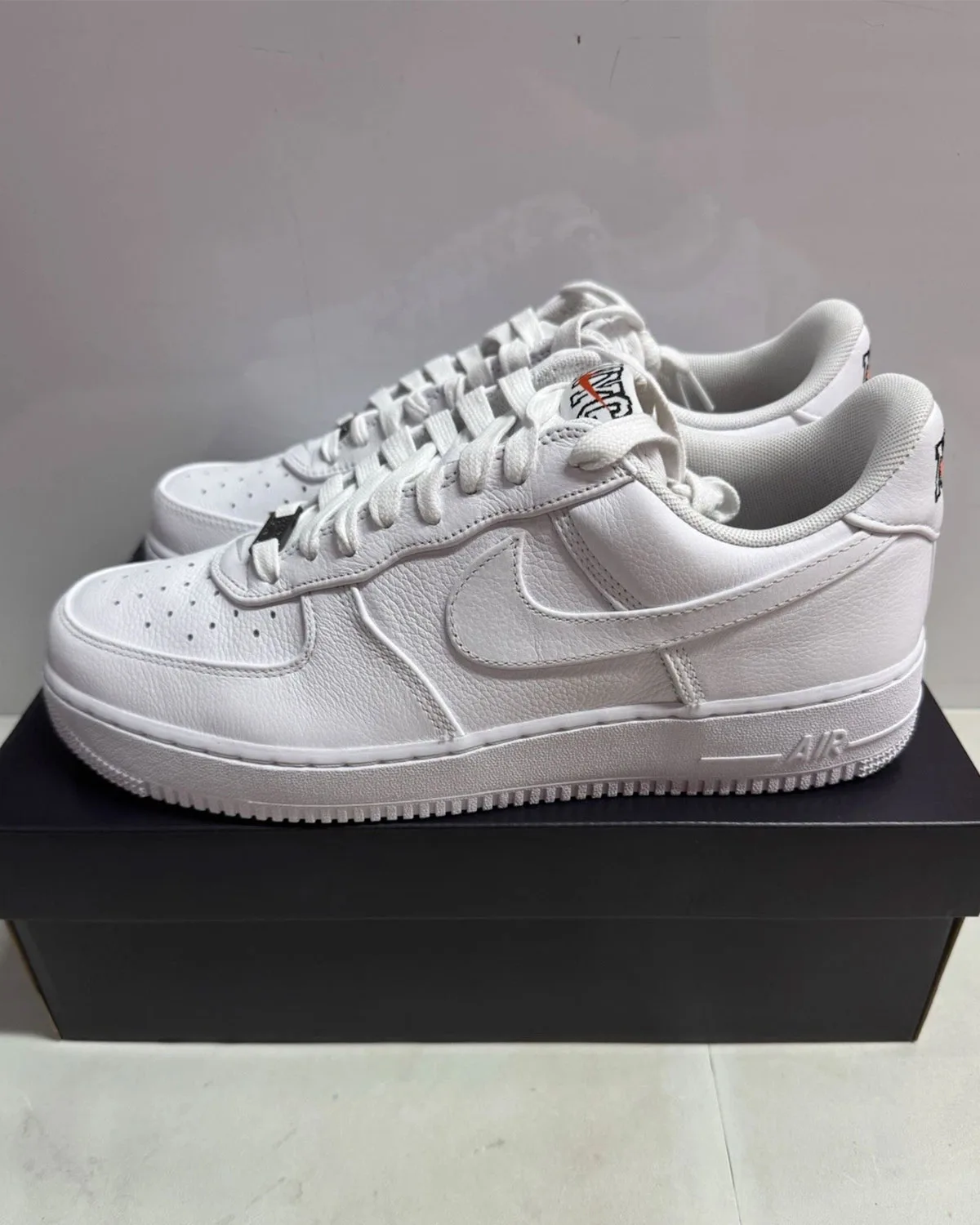 Front three-quarter view of the pair of NYC Triple White