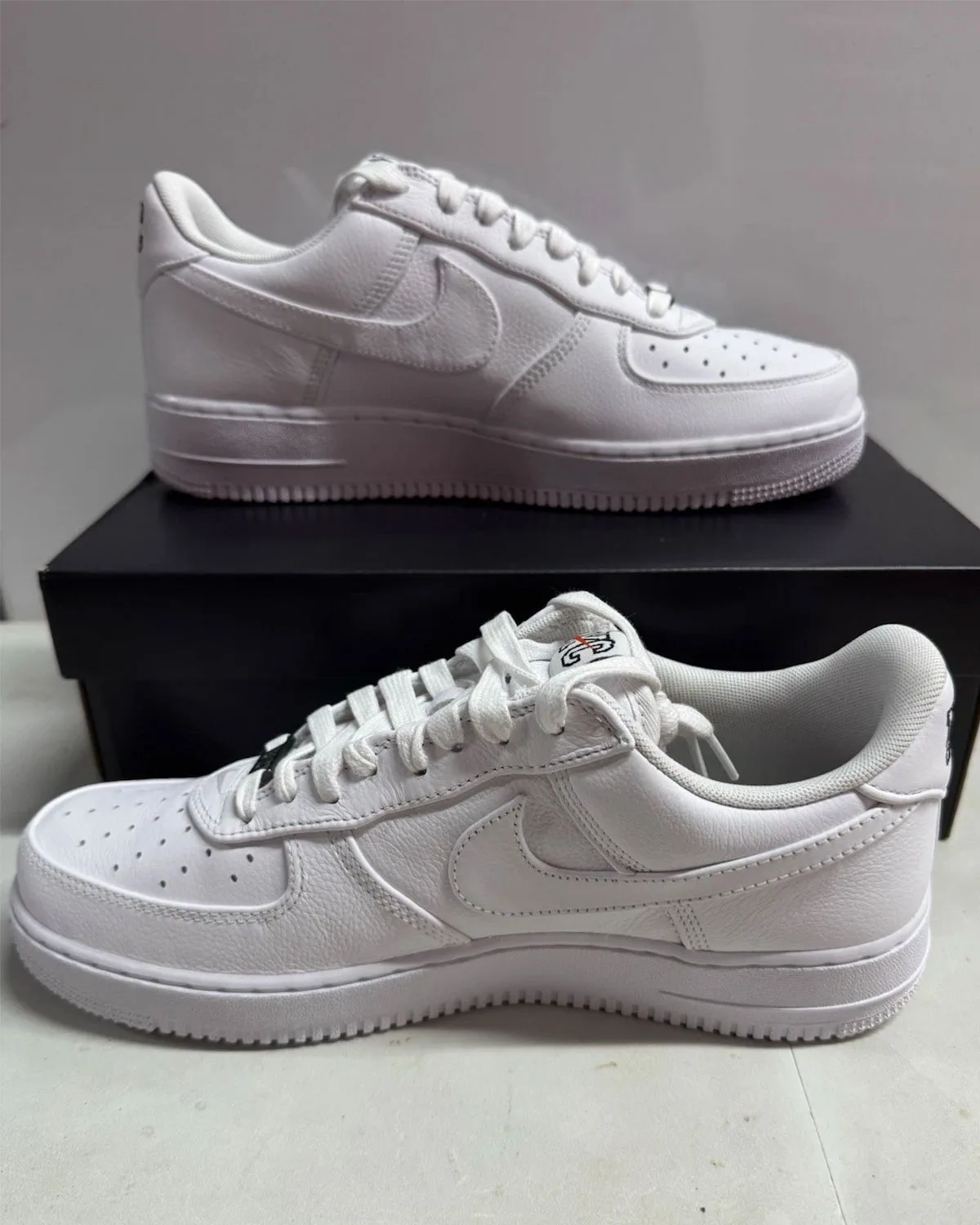 Front three-quarter view of the pair of NYC Triple White