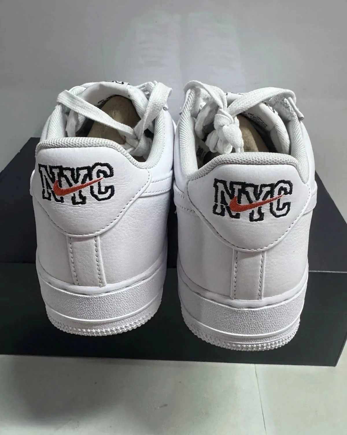 Front three-quarter view of the pair of NYC Triple White
