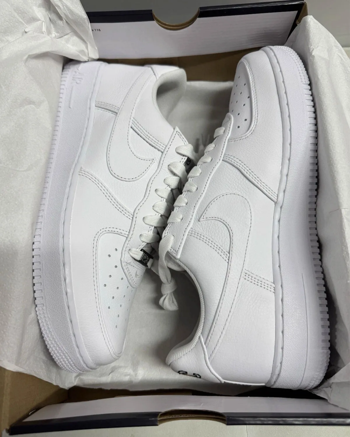 Front three-quarter view of the pair of NYC Triple White