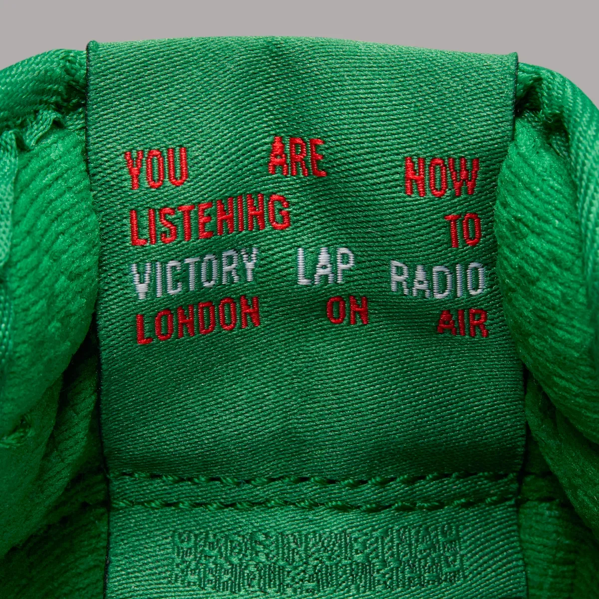 Inner tongue detail with red and white Victory Lap Radio text on green, Pine Green