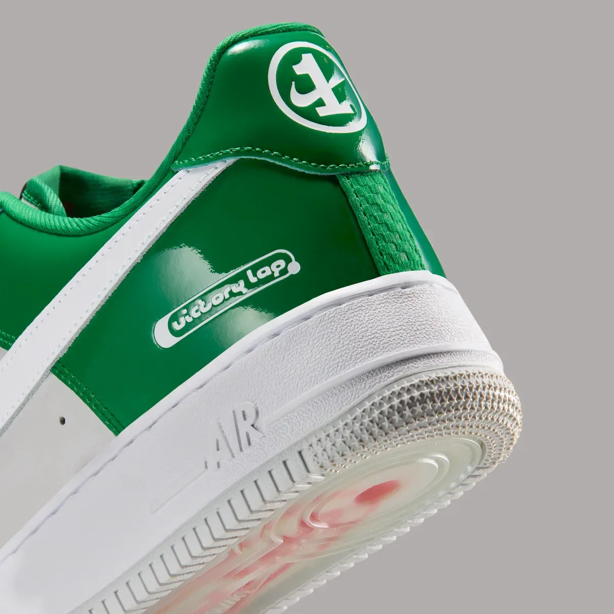 Heel detail with glossy green panels and white Victory Lap branding, Pine Green
