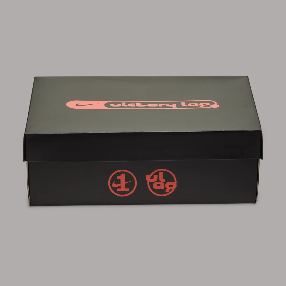 Packaging with coral Victory Lap branding and circular logos on a dark box, Pine Green