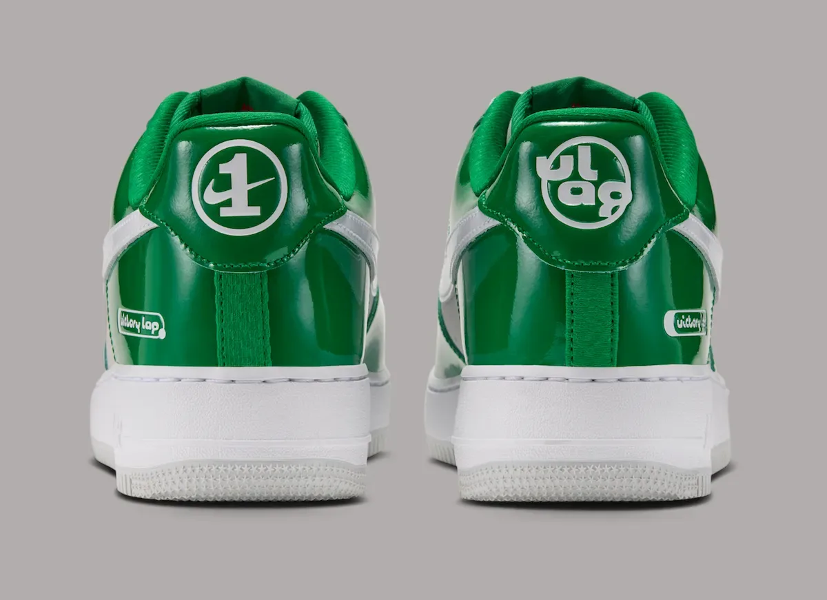 Heel view of pair with white circular logos on glossy green tabs, Pine Green