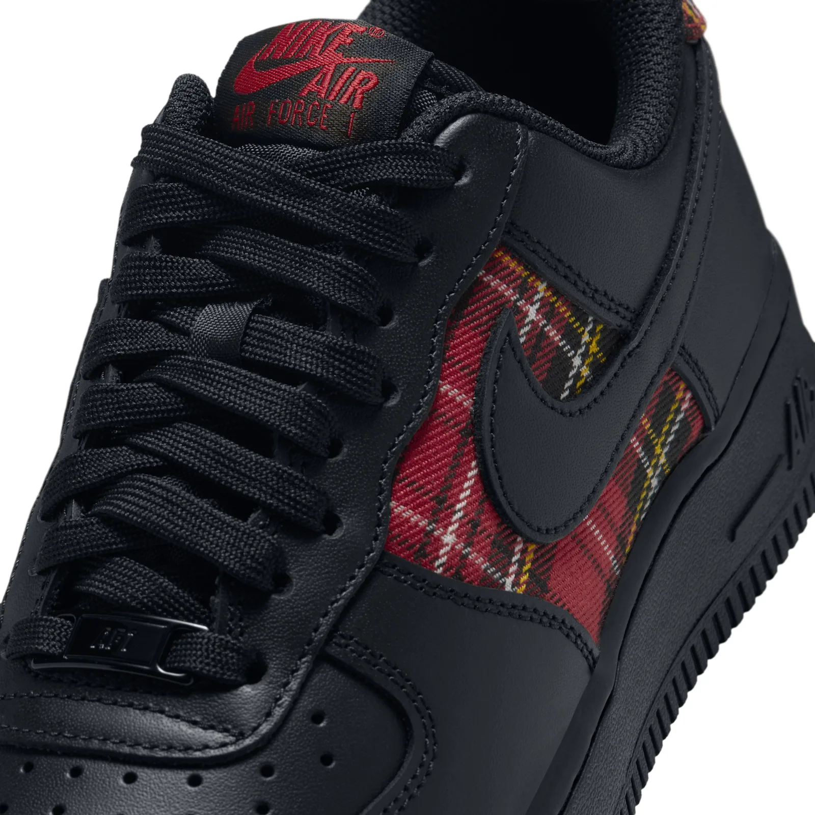 Detail of laces and tongue, red Nike Air Force 1 label and red tartan panel behind the swoosh, Red Plaid
