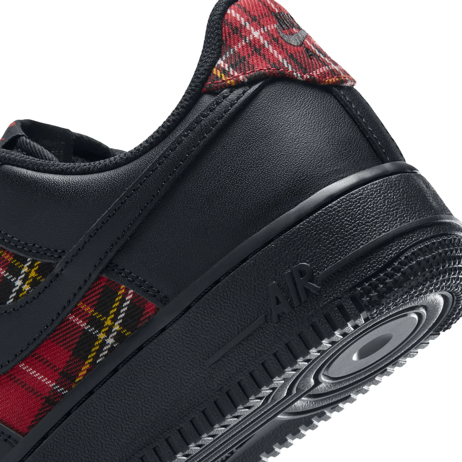 Heel detail, red plaid collar tab above black leather and AIR text on the midsole, Red Plaid
