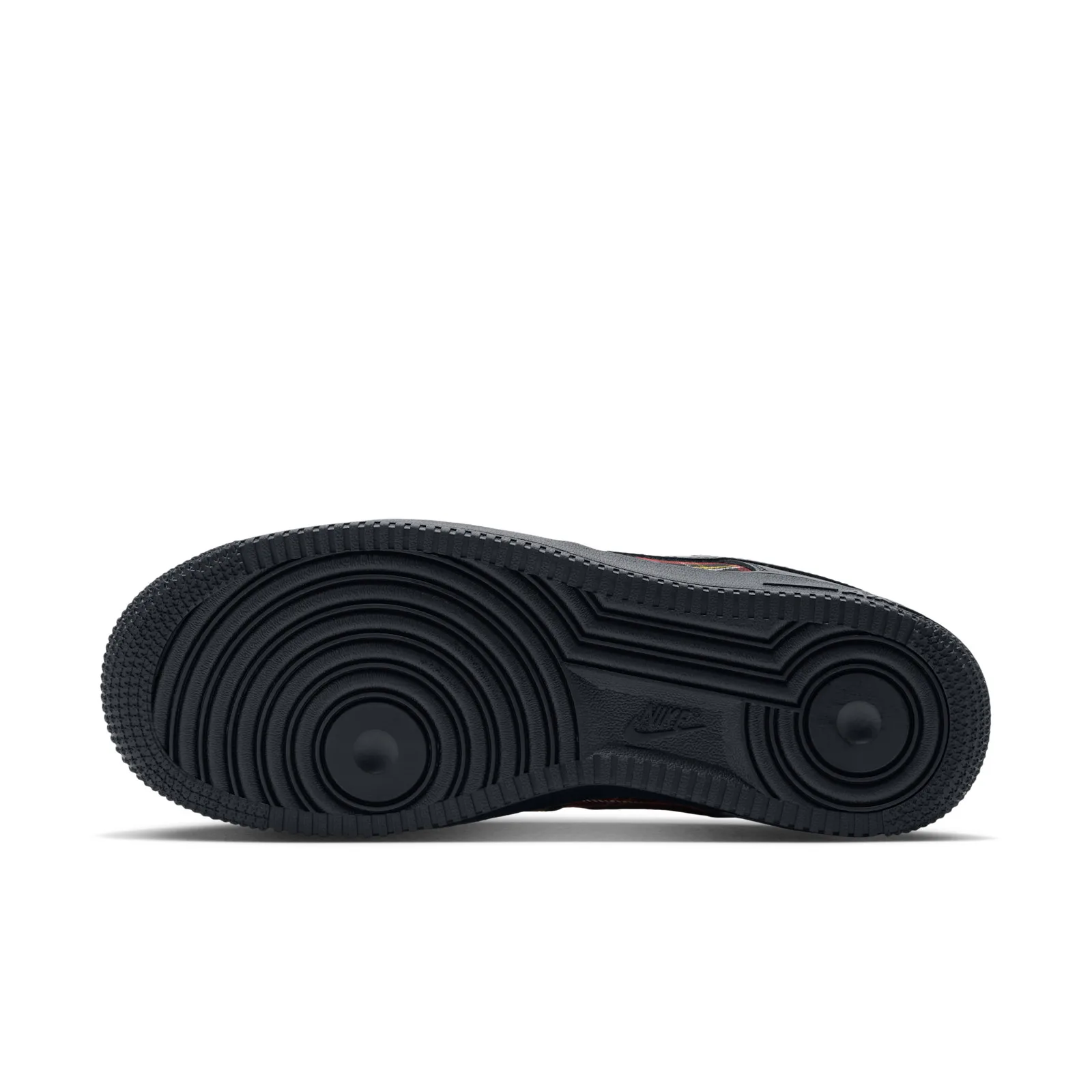 Outsole view, black rubber with concentric circular tread and small Nike logo at the arch, Red Plaid