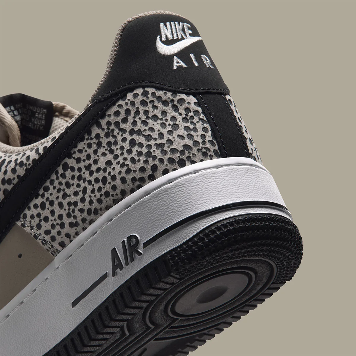 Detail of heel, white Nike Air embroidery on black tab, AIR on white midsole, Safari