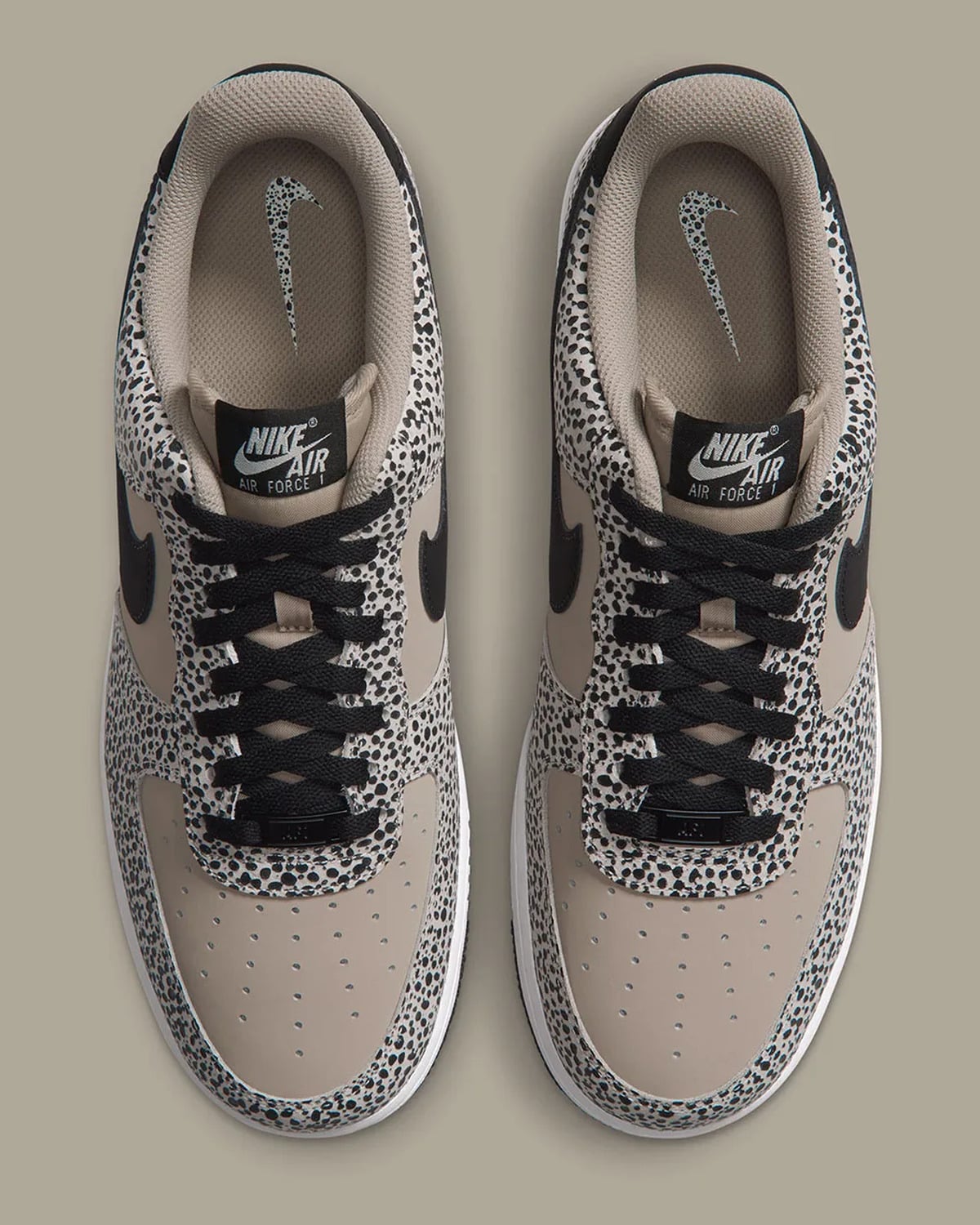 Top-down view of pair, black crisscross laces, dotted swoosh on insoles, Safari