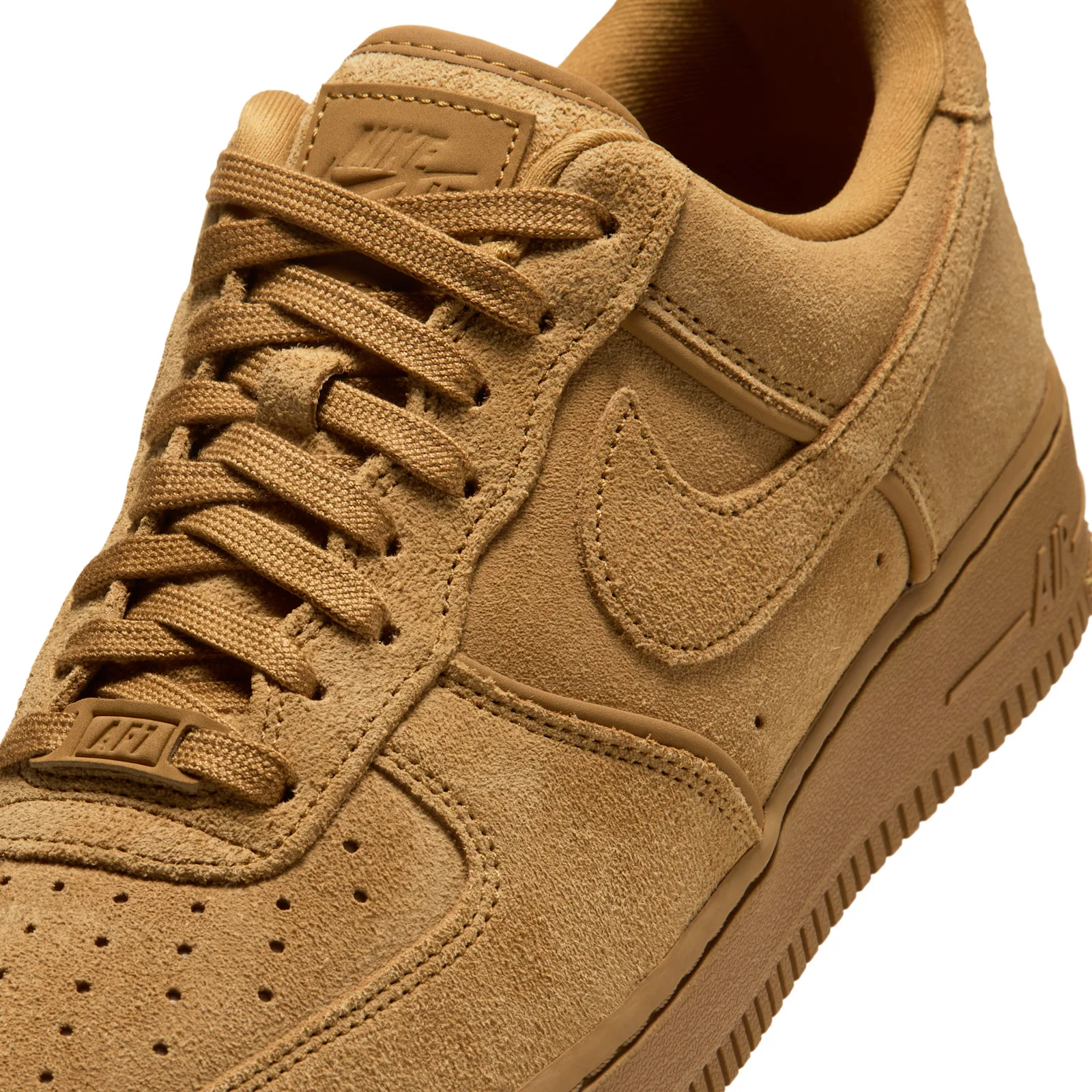 Detail of tan suede toe and laces with tonal swoosh, embossed tongue logo and AF1 lace tag, Wheat