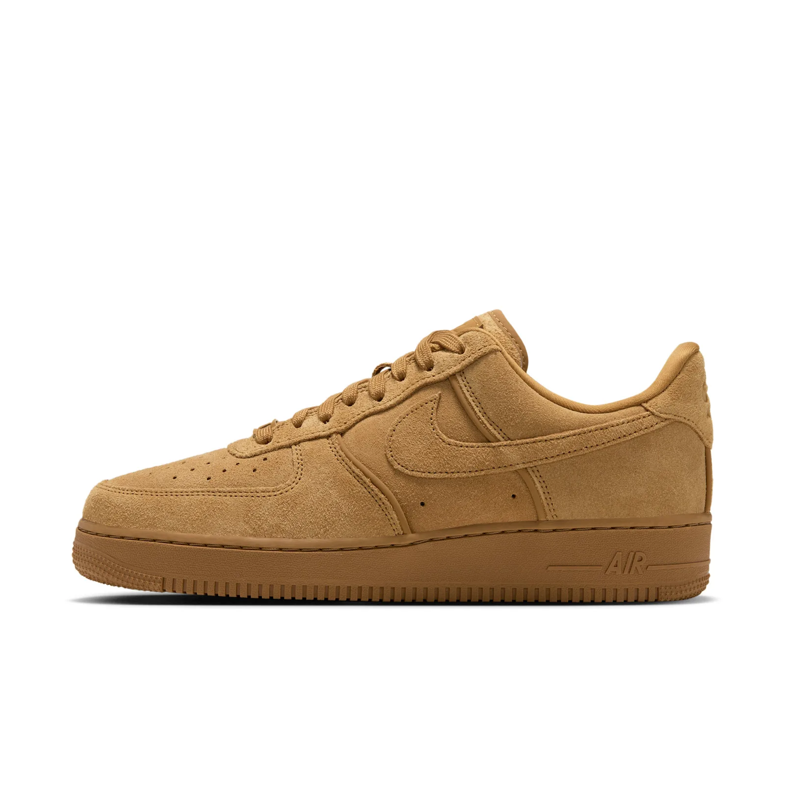 Lateral view of tan suede low-top with tonal swoosh and AIR logo on the gum midsole, white background, Wheat