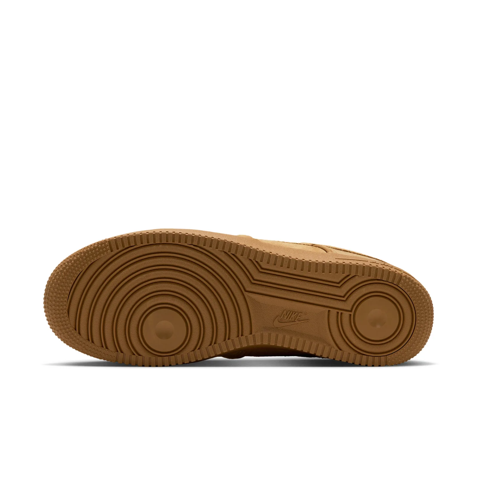 Outsole view showing tan concentric circular tread pattern and a small Nike logo at the centre, Wheat