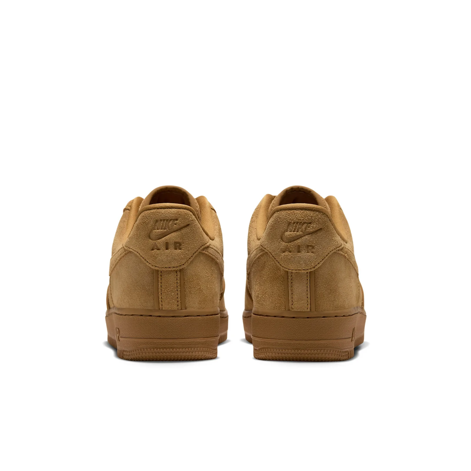 Heel view of the pair with embossed Nike Air logo on the tan suede heel tabs and gum midsoles, Wheat