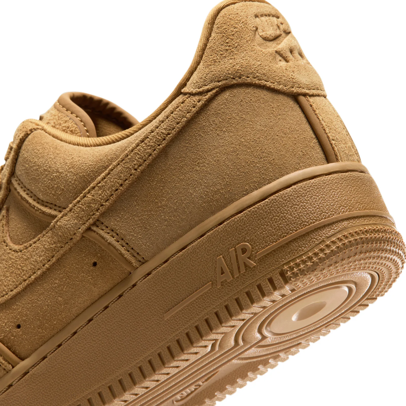 Detail of heel and midsole with raised AIR lettering, star-patterned tread edge and tan suede, Wheat