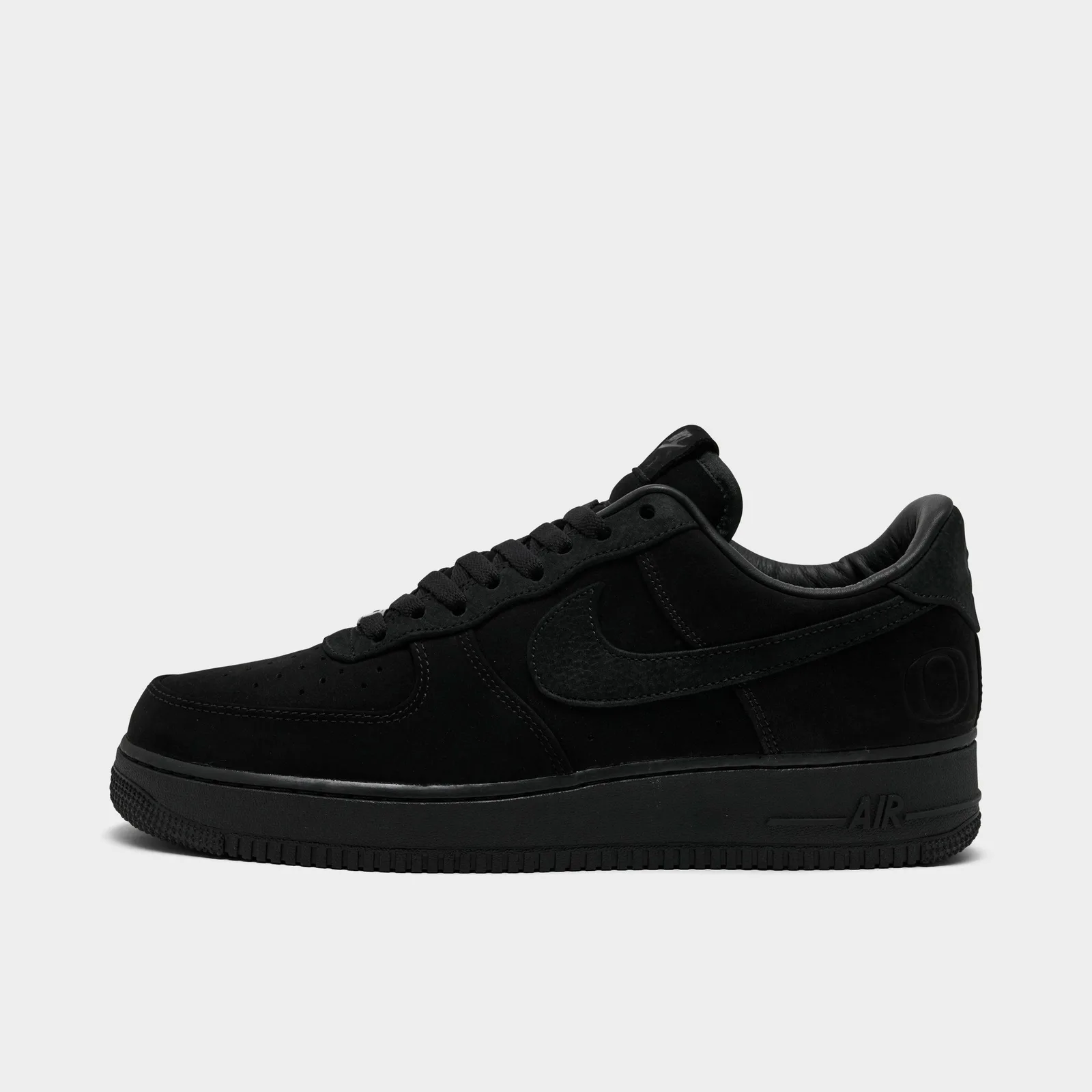 Lateral view with black suede panels, tonal Swoosh and Oregon O at the heel, Triple Black