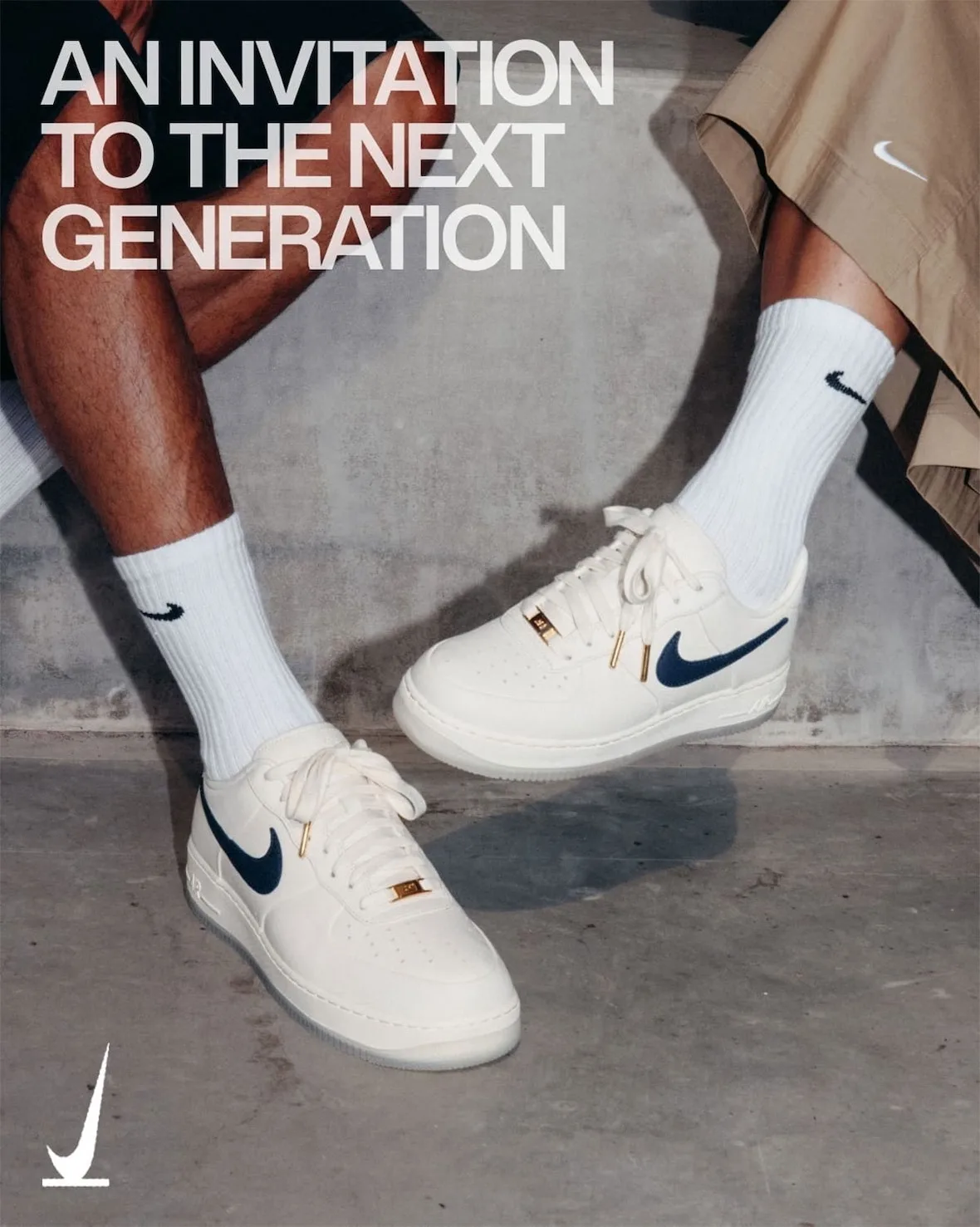 On-foot pair on concrete, white Nike crew socks, navy swoosh, gold lace tags and tips, text overlay, SNKRS Friends & Family
