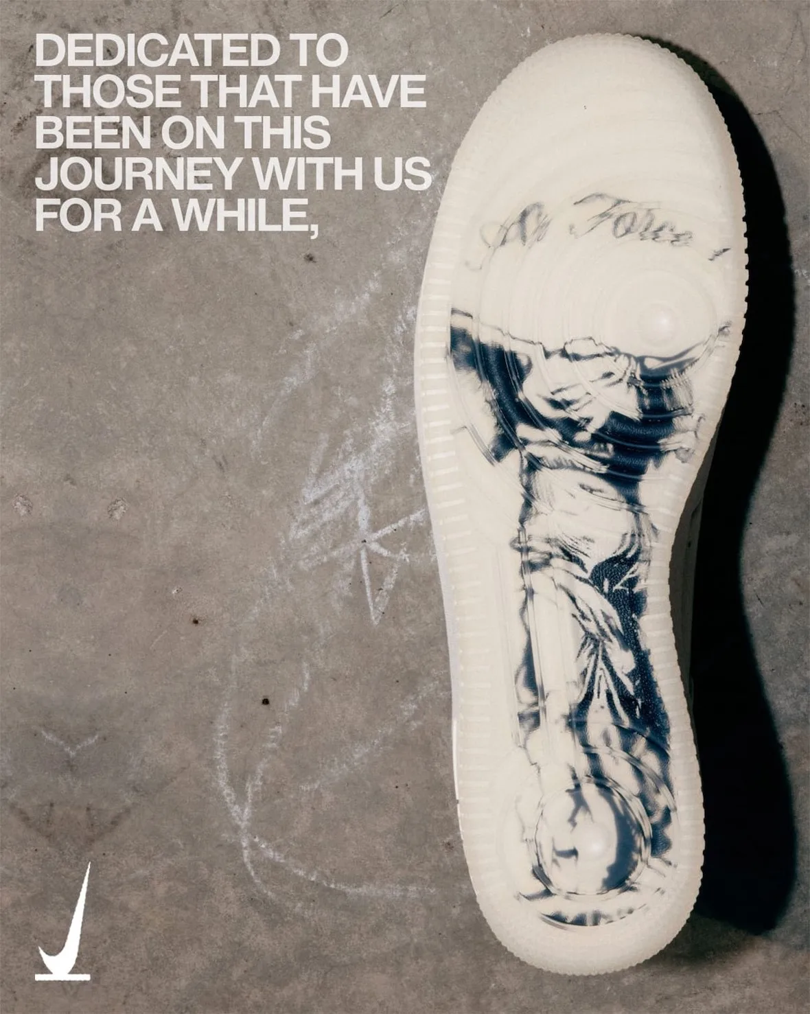 Outsole view with navy marbled statue-like print and script text, on chalk-marked concrete, SNKRS Friends & Family