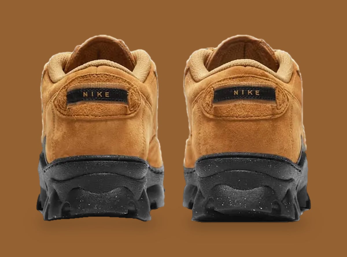 Heel view of tan suede pair with black NIKE pull tabs and speckled black soles, Black