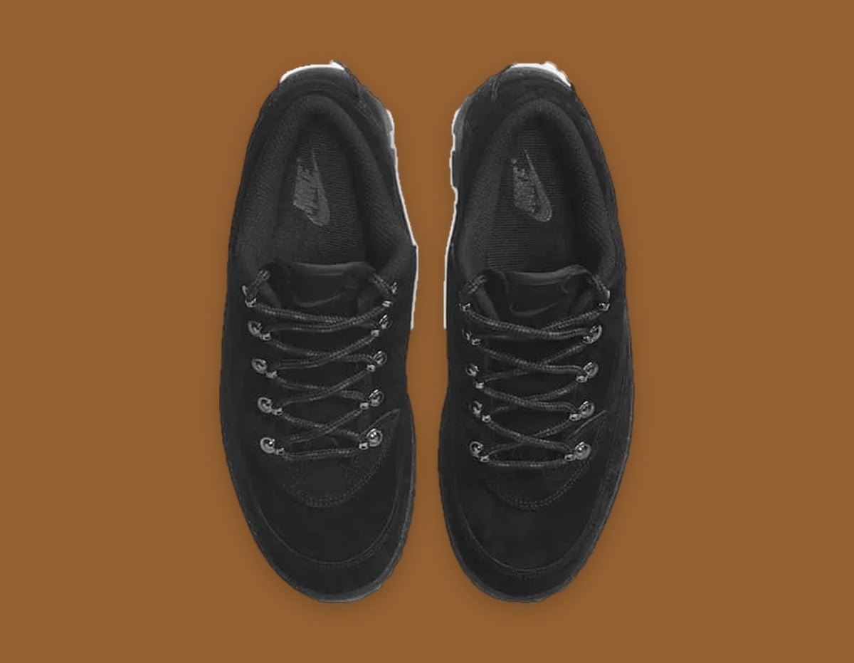 Top-down view of all-black suede pair with black laces and tonal Nike insoles, Black