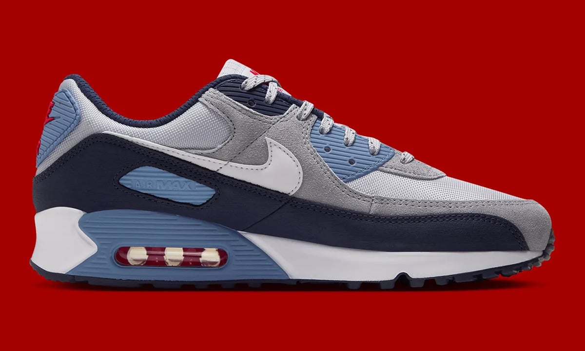 Medial view, white swoosh, navy overlay, light blue heel unit with red Air window, Geyser Grey