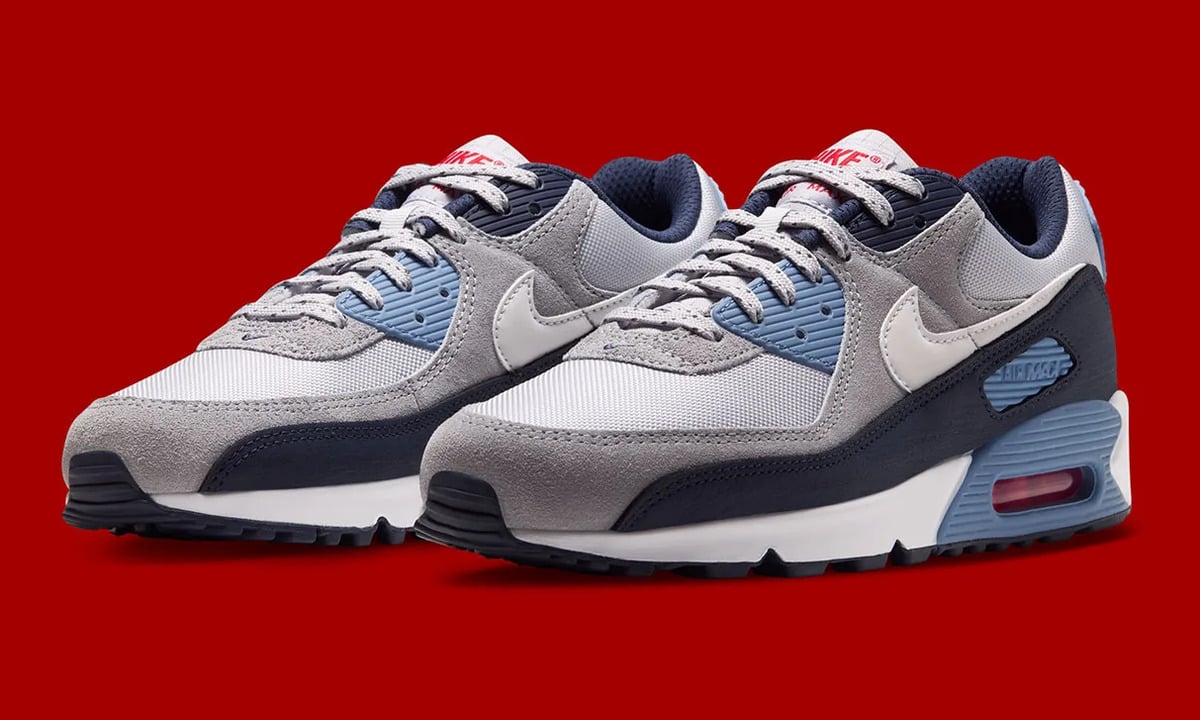 Pair, three-quarter view, grey and navy upper with light blue accents on red, Geyser Grey