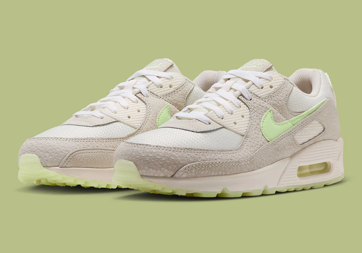Pair at a front three-quarter angle with cream mesh and pale green Swooshes, Glow In The Dark Safari