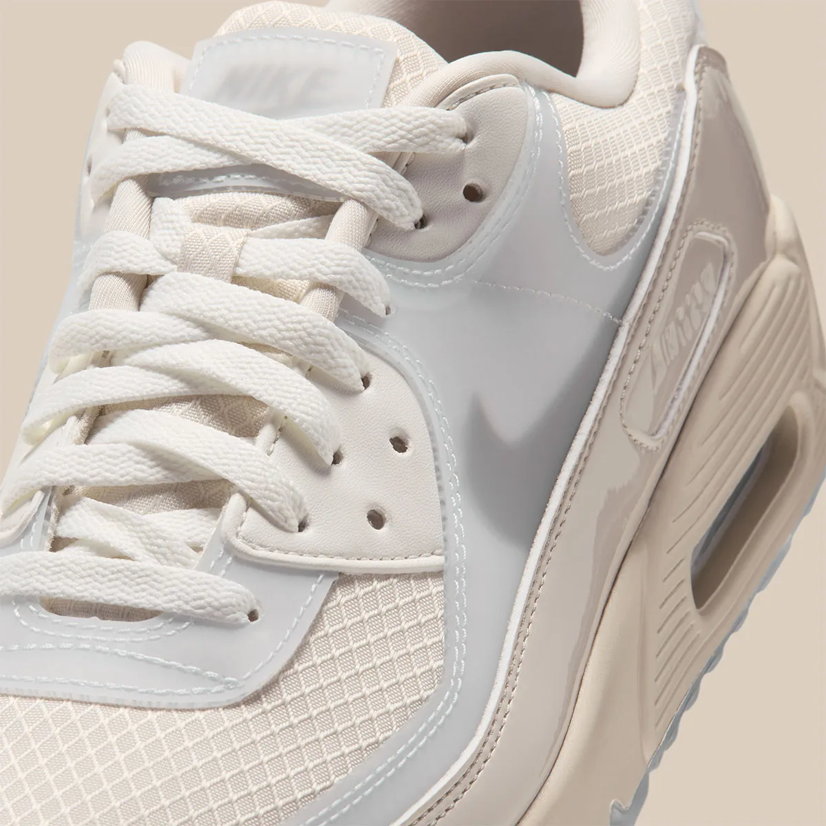 Close-up of laces and forefoot with cream mesh, glossy grey overlays and tan midsole, Light Orewood Brown