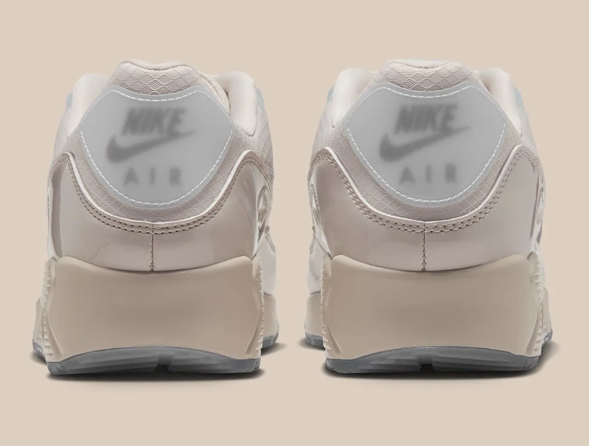 Heel view of pair showing grey Nike Air logo on translucent tab, Light Orewood Brown