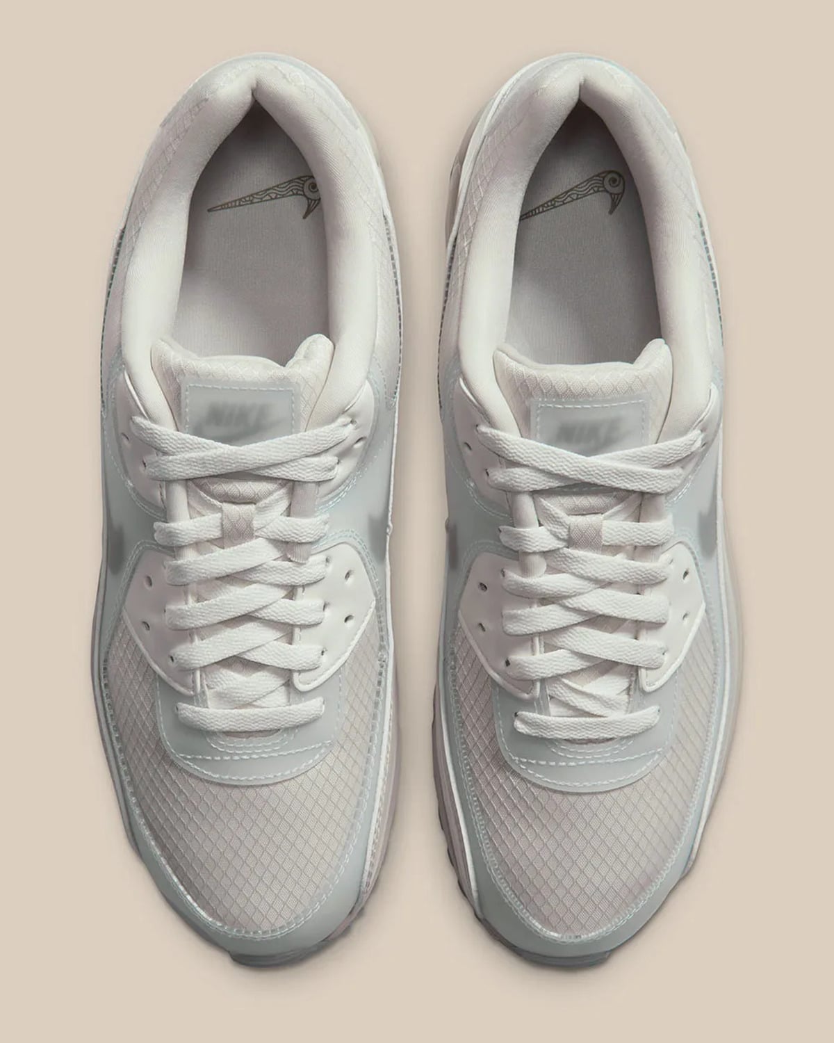 Top-down view of pair with cream laces, mesh toe and bird-head Swoosh insoles, Light Orewood Brown