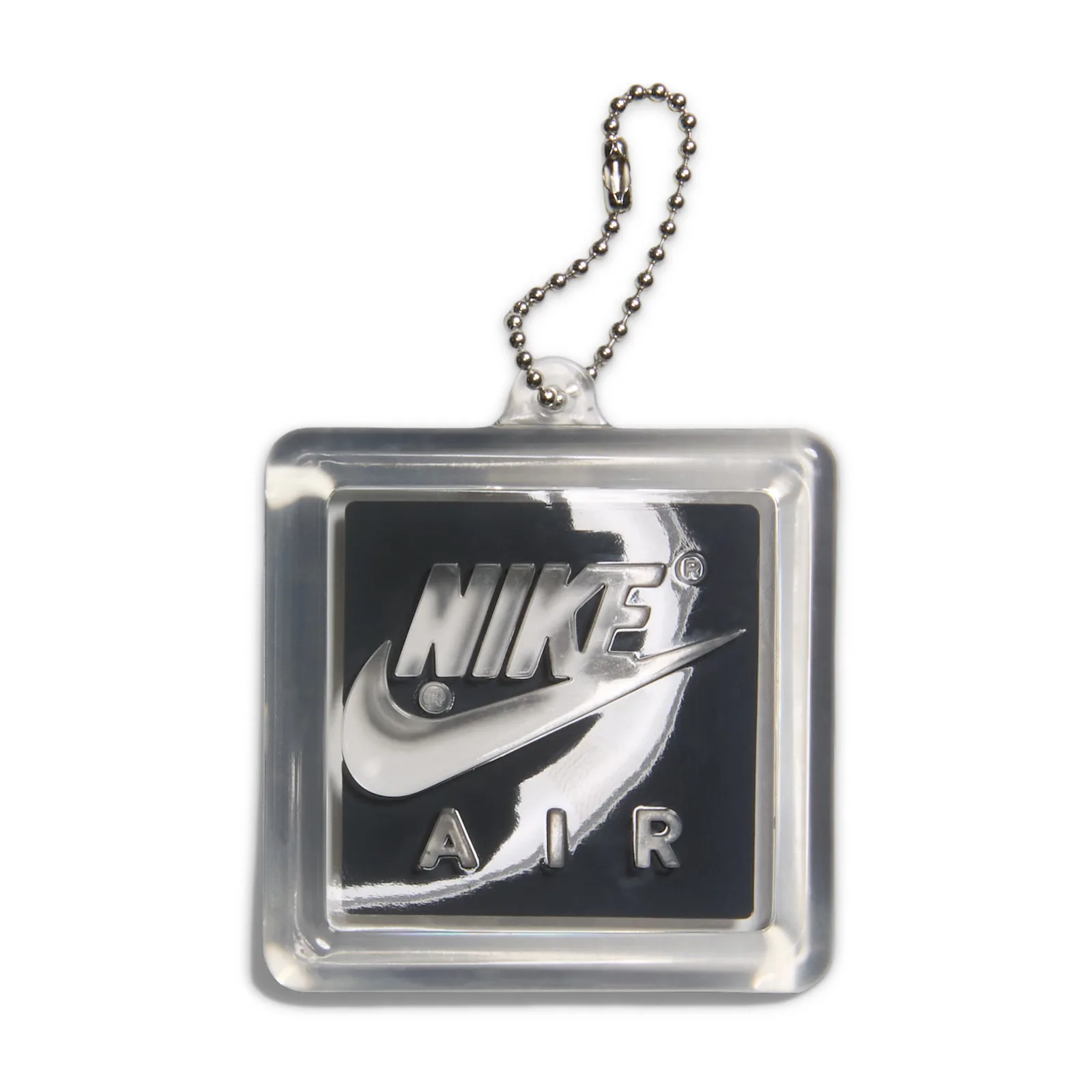 Hang tag with ball chain, clear square frame, black panel with chrome Nike swoosh and AIR lettering, Light Smoke Grey