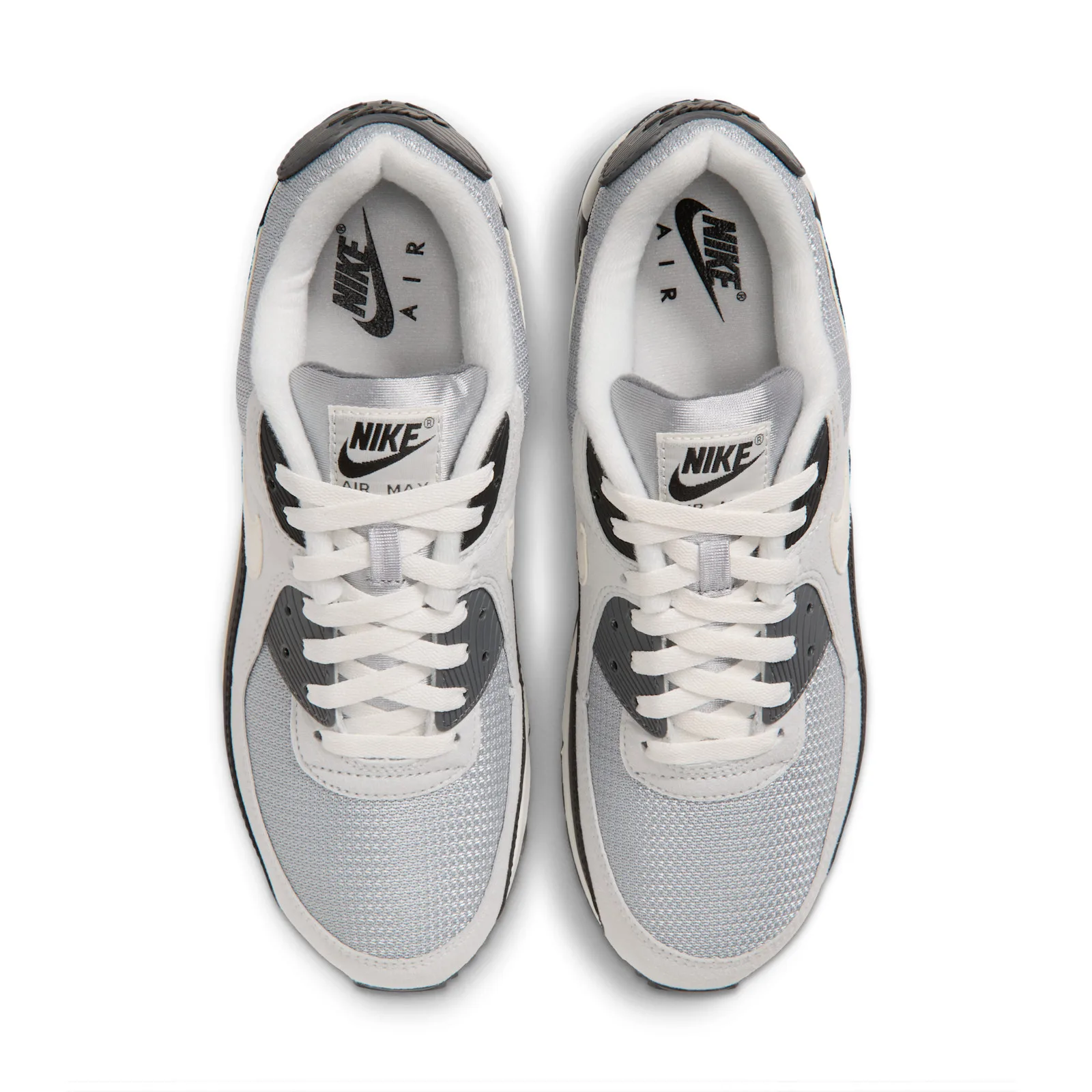 Top-down view of pair, cream laces, Nike tongue labels, grey mesh toe, white lining, Nike Air insoles, Light Smoke Grey