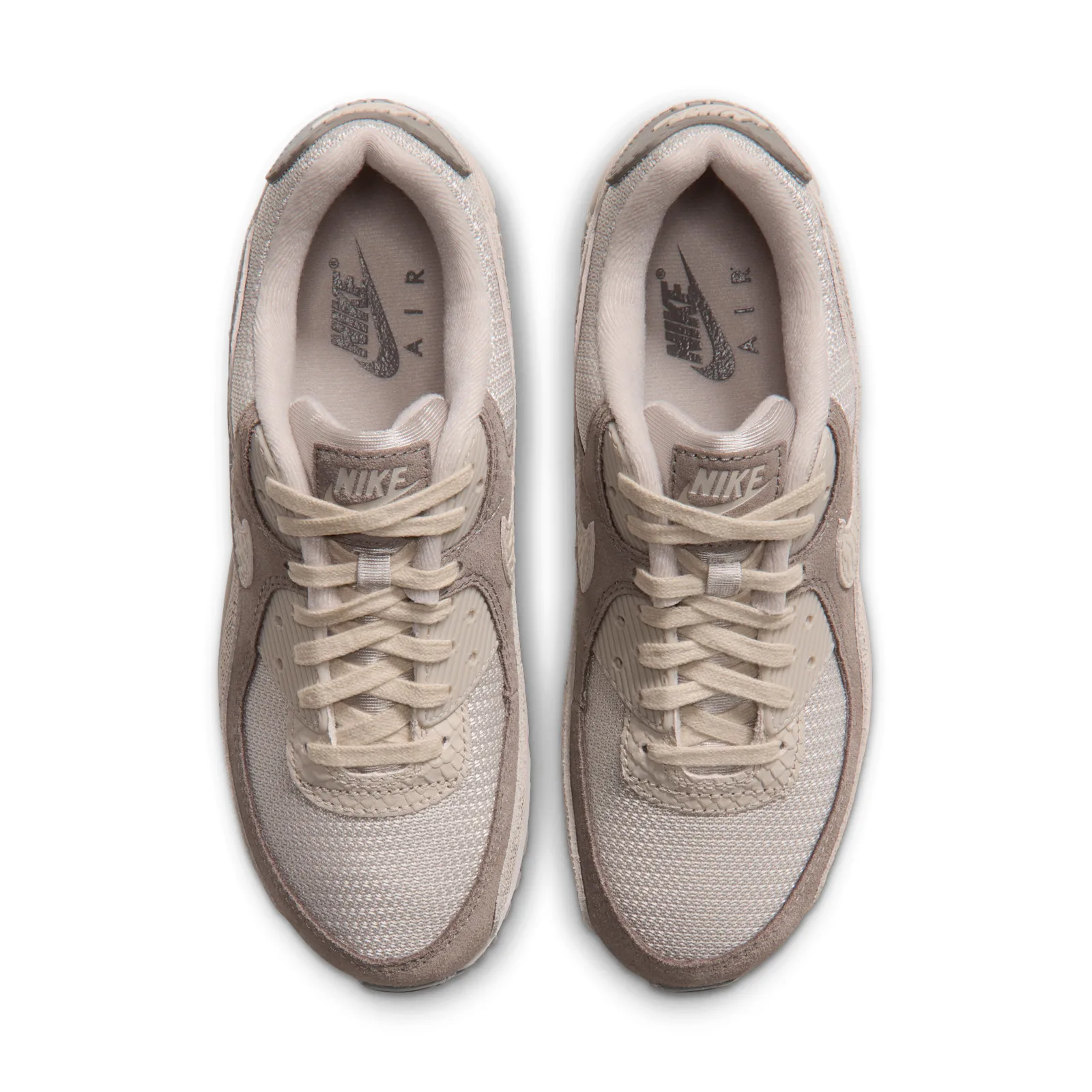 Top-down view of pair with cream laces and Nike Air logos on the insoles, Python