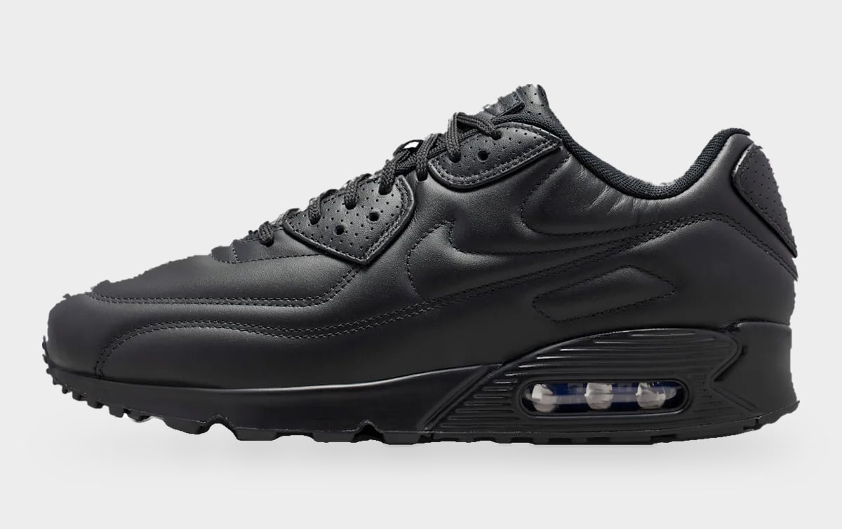 Lateral view, black quilted leather with stitched swoosh and a visible heel air unit, Black Leather