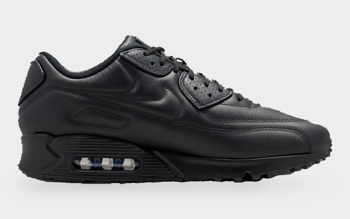 Medial view, all-black leather with stitched swoosh and a heel air unit with blue tint, Black Leather