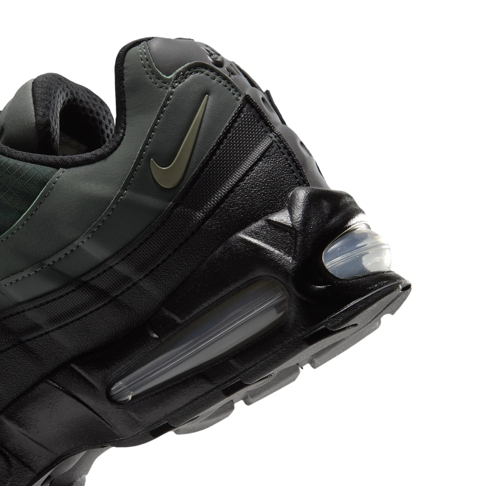 Heel detail, olive swoosh on grey-green panel above black heel and clear air unit, Camo Green