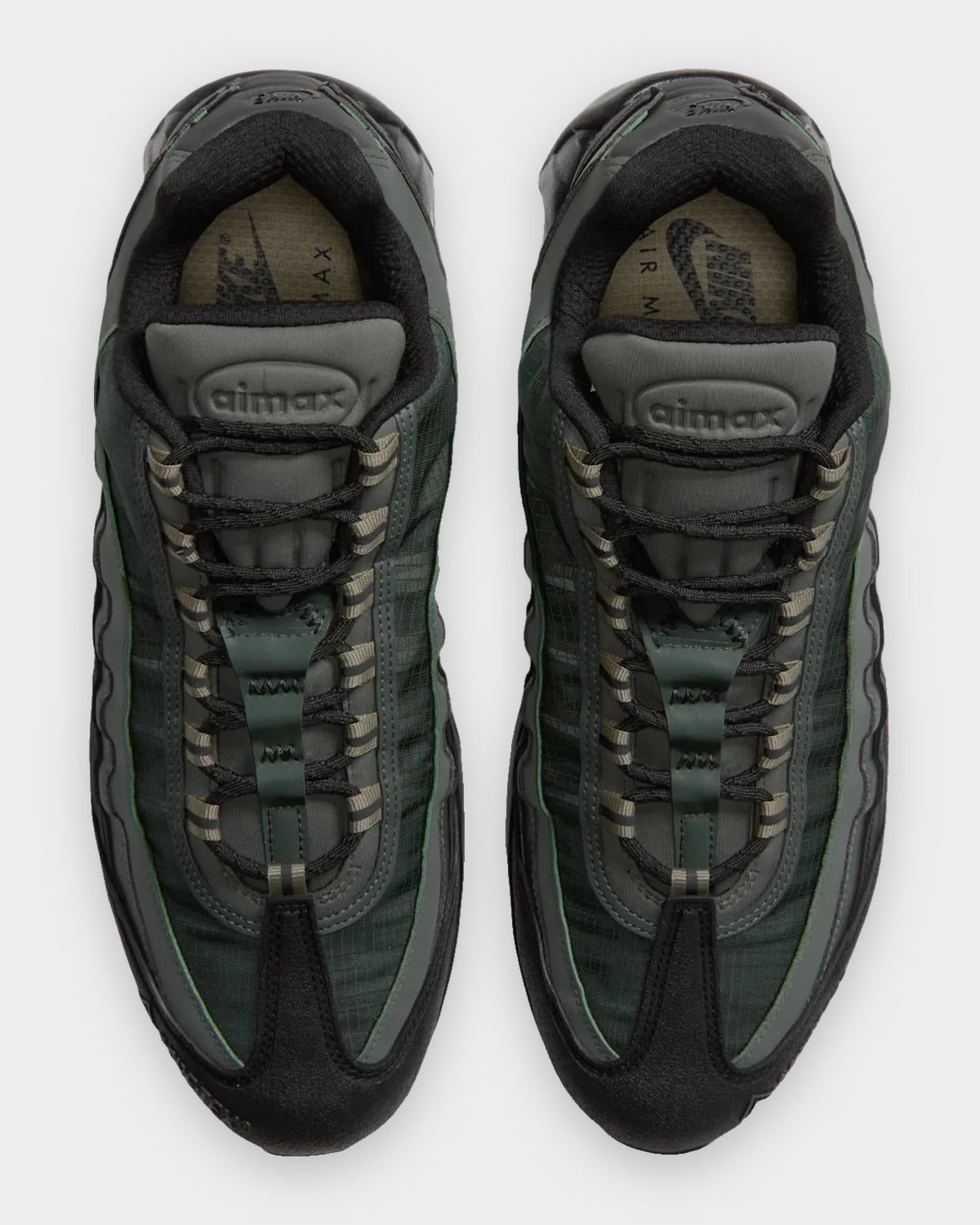 Top-down pair, black laces with olive tape loops, airmax tongue labels, olive insoles, Camo Green