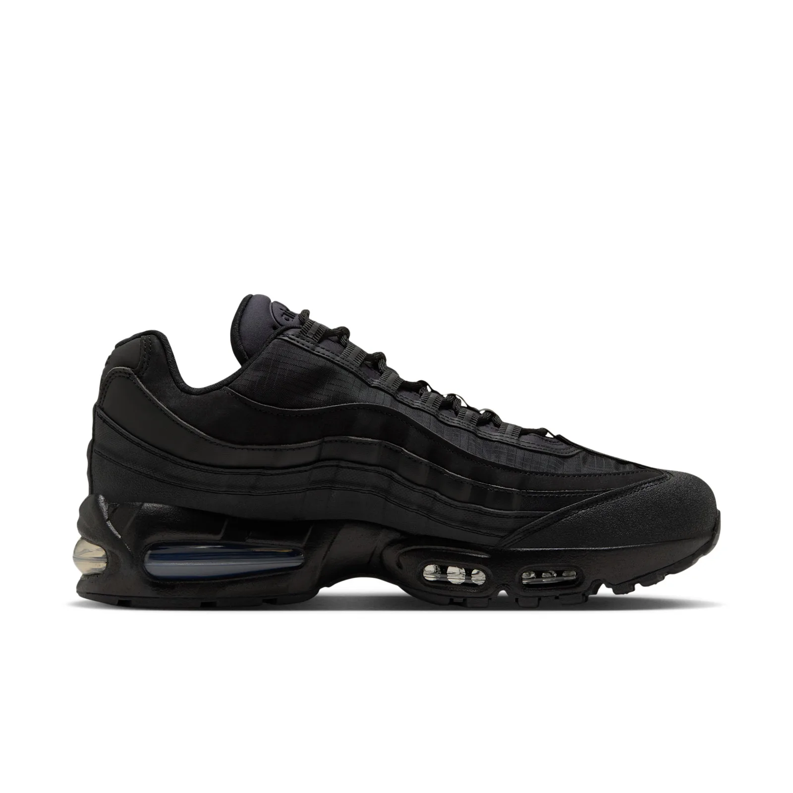 lateral side, white background, suede toe and ripstop panels, stitched tongue, Triple Black