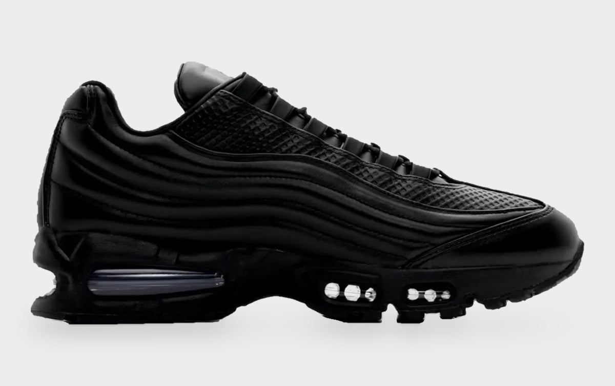 Medial side view, all-black ridged leather with grid-textured panel and heel Air window, Black