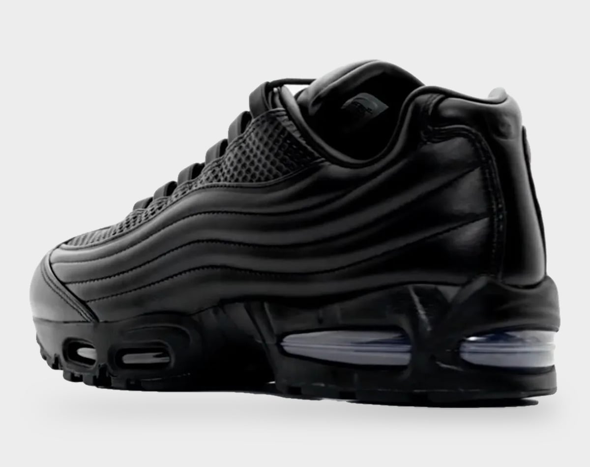 Rear three-quarter view, black leather heel with wavy ridges and visible Air units, Black