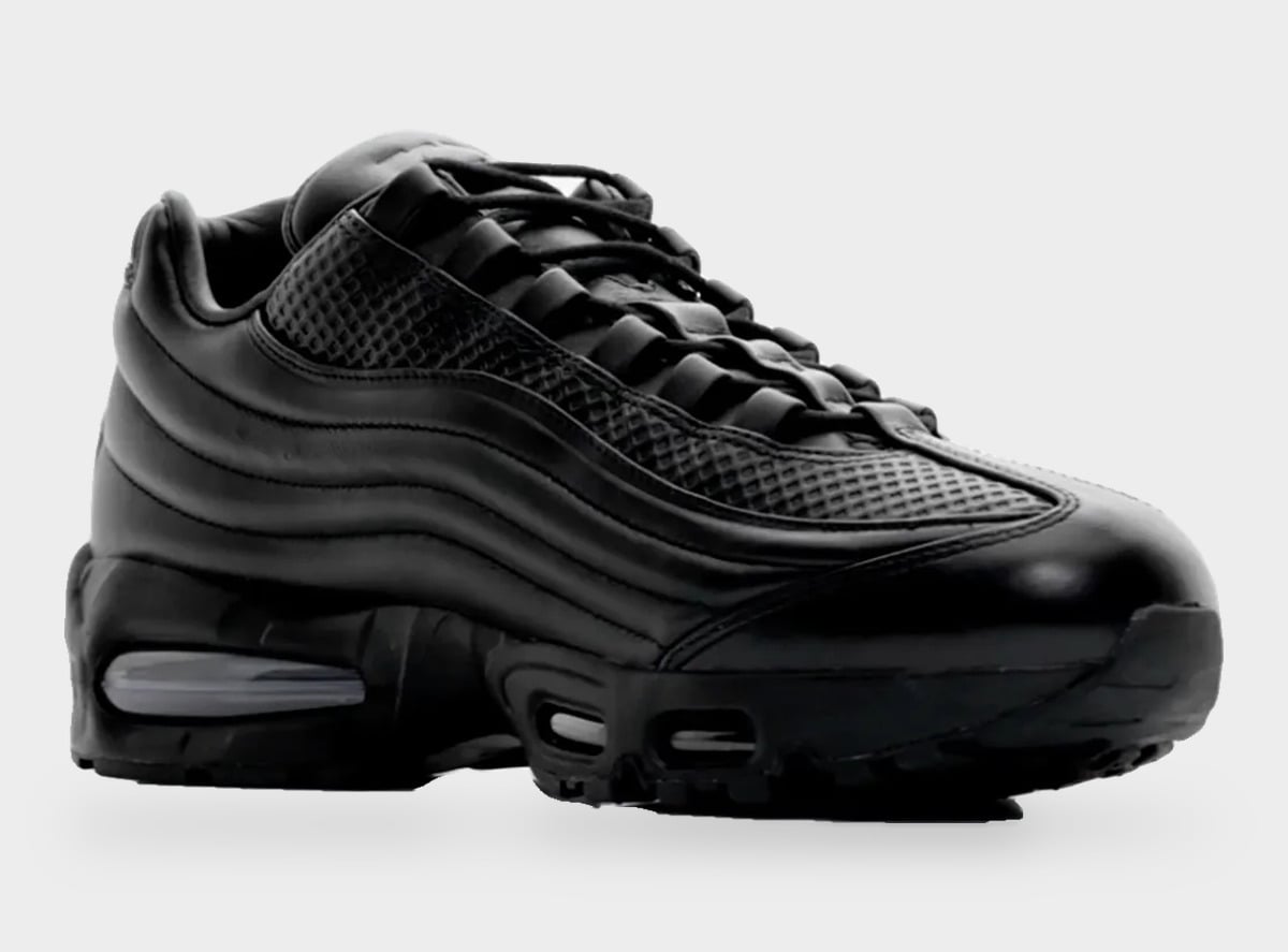 Medial three-quarter view from the heel side, all-black ridged leather and visible Air unit, Black