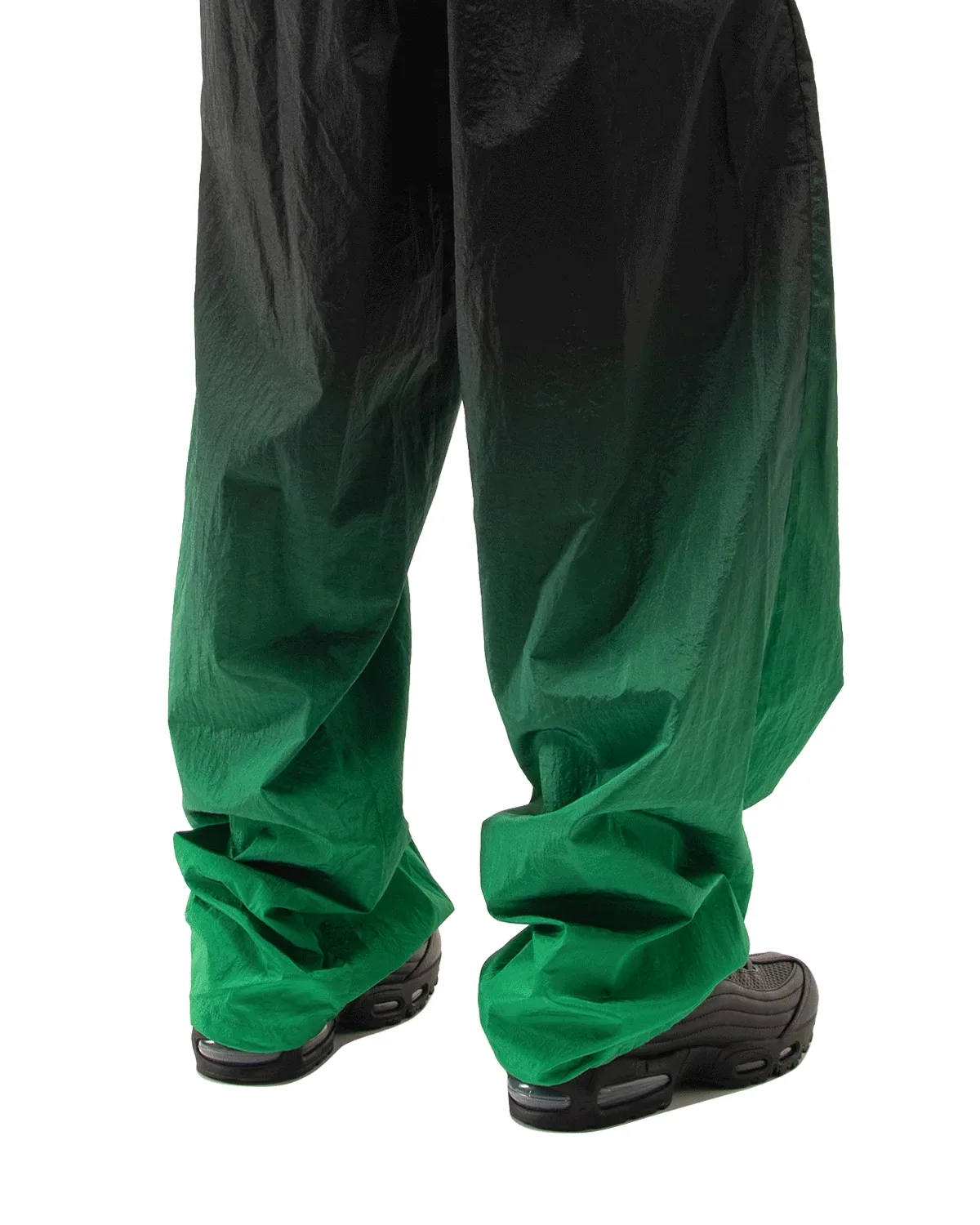 On-foot rear view, black shoes with Air heel under black-to-green gradient trousers, Black