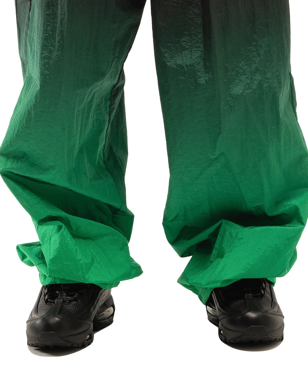 On-foot view, black pair with toe caps under black-to-green gradient wide trousers, Black