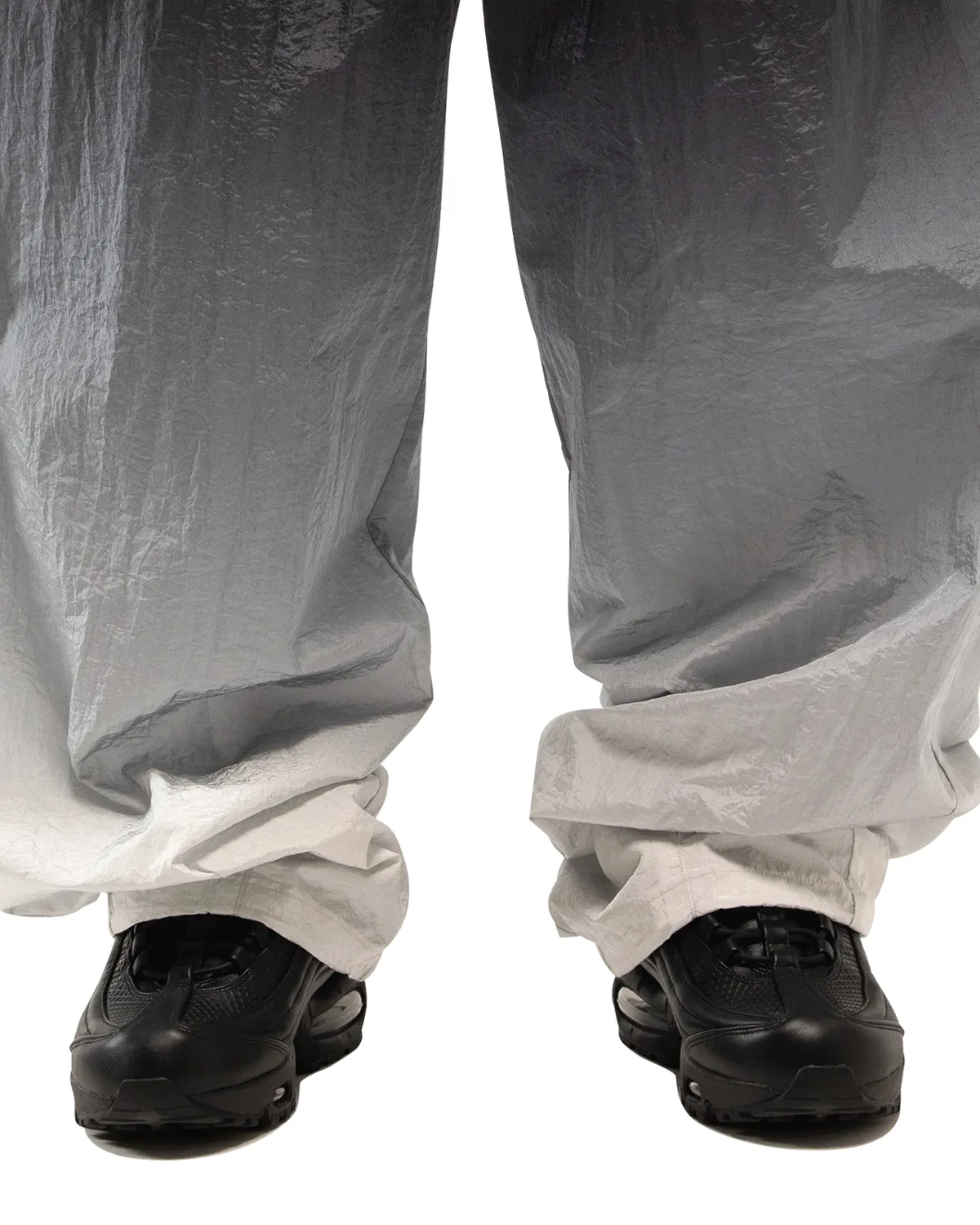 On-foot front view, black pair under wide black-to-white gradient nylon trousers, Black
