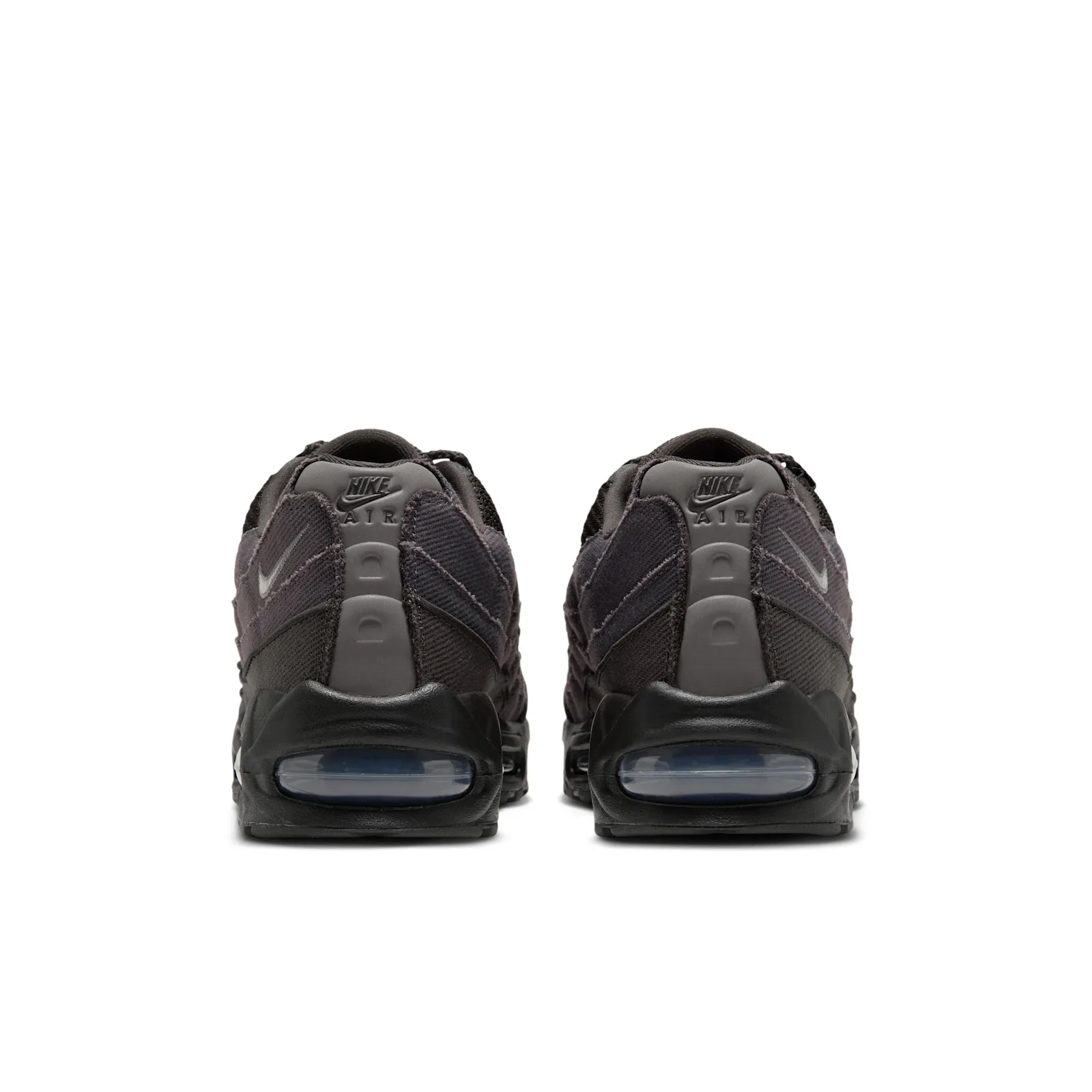Heel view of the pair, grey heel tabs with Nike Air text and blue-tinted air units, Medium Ash