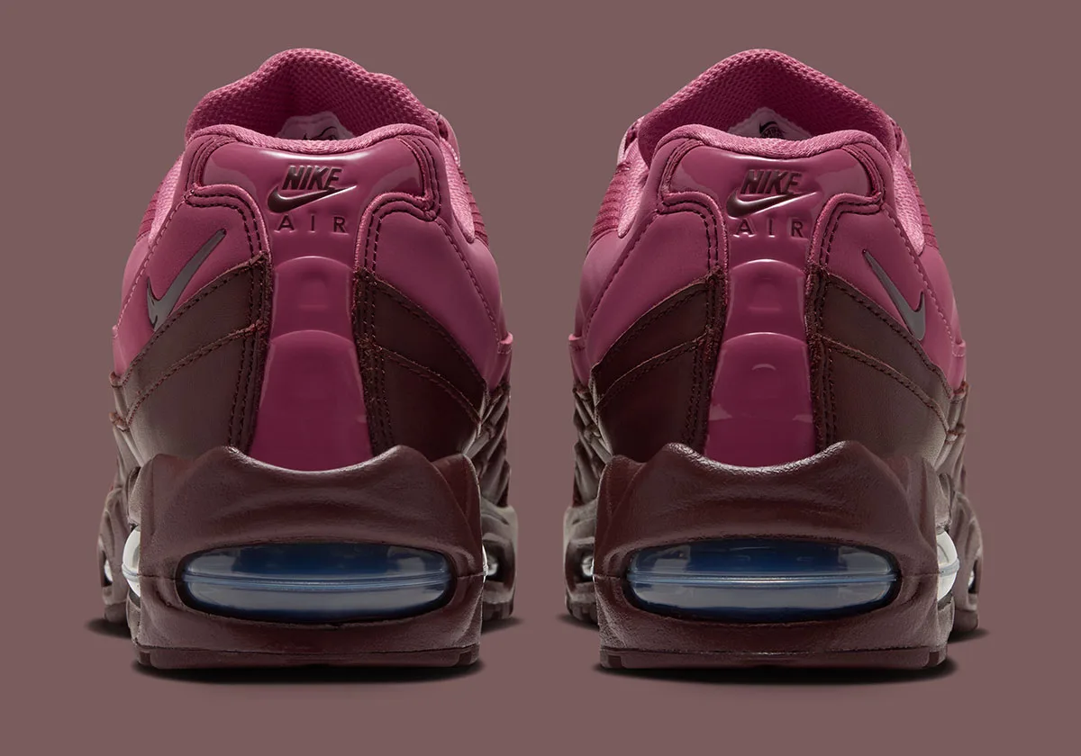 Heel view of pair, Nike Air logo on pink tabs, blue air windows in burgundy heels, Mystic Dates