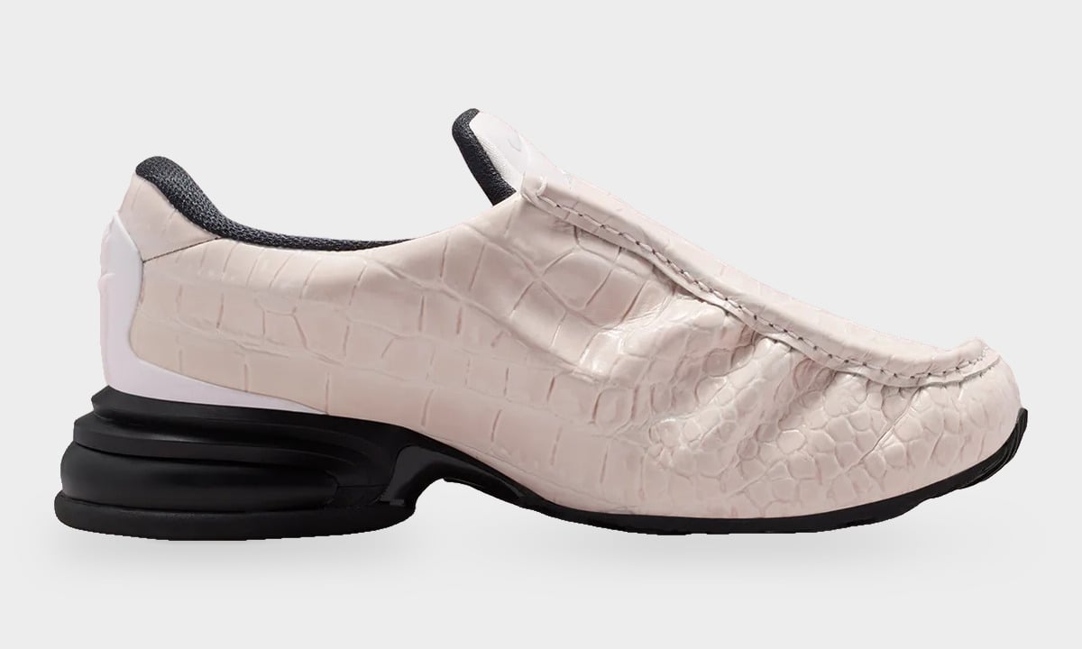 Lateral view of pale pink croc-embossed slip-on, black heel unit, white heel clip, Pearl Pink