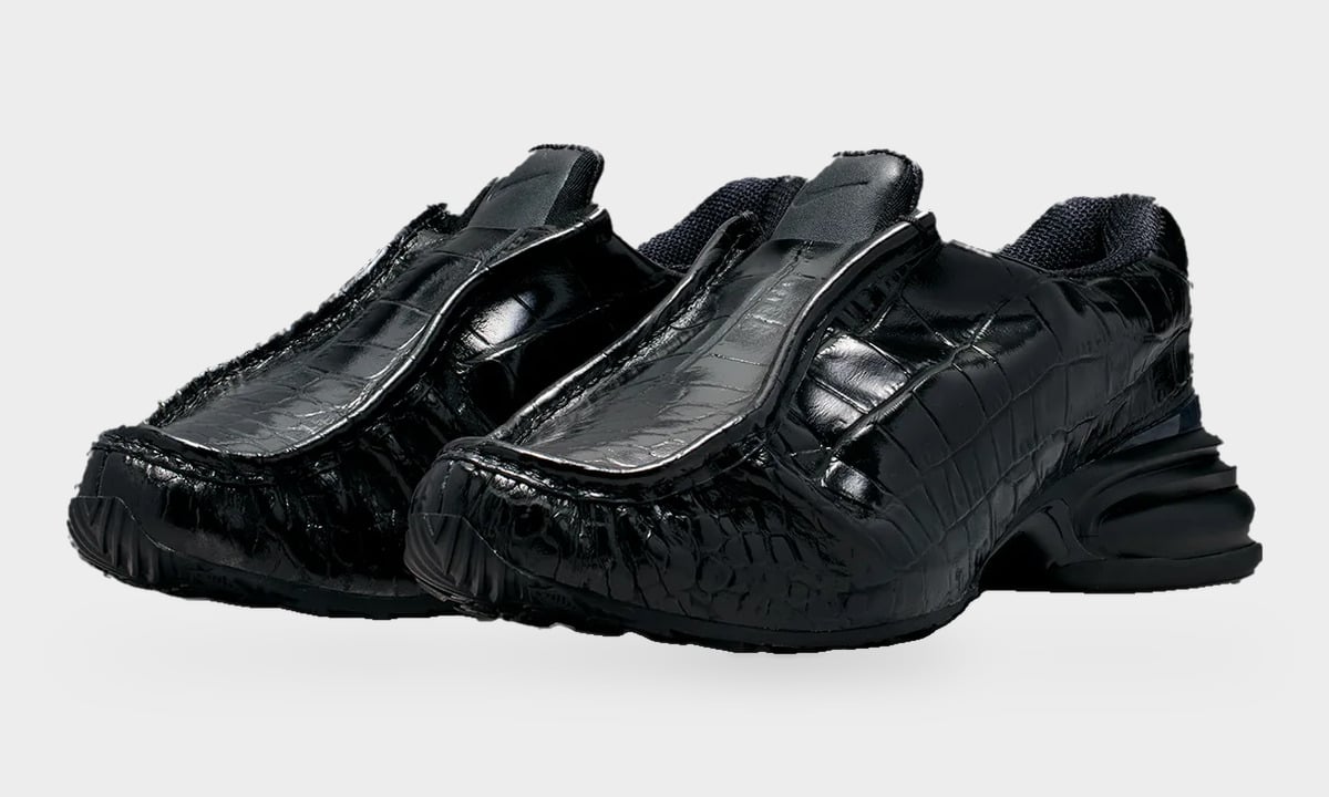 Pair, three-quarter view of glossy black croc-embossed slip-ons, matching black soles, Pearl Pink