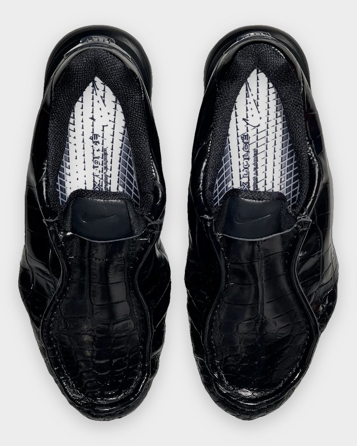 Top-down view of pair in black croc leather, white insoles with printed graphics, Pearl Pink